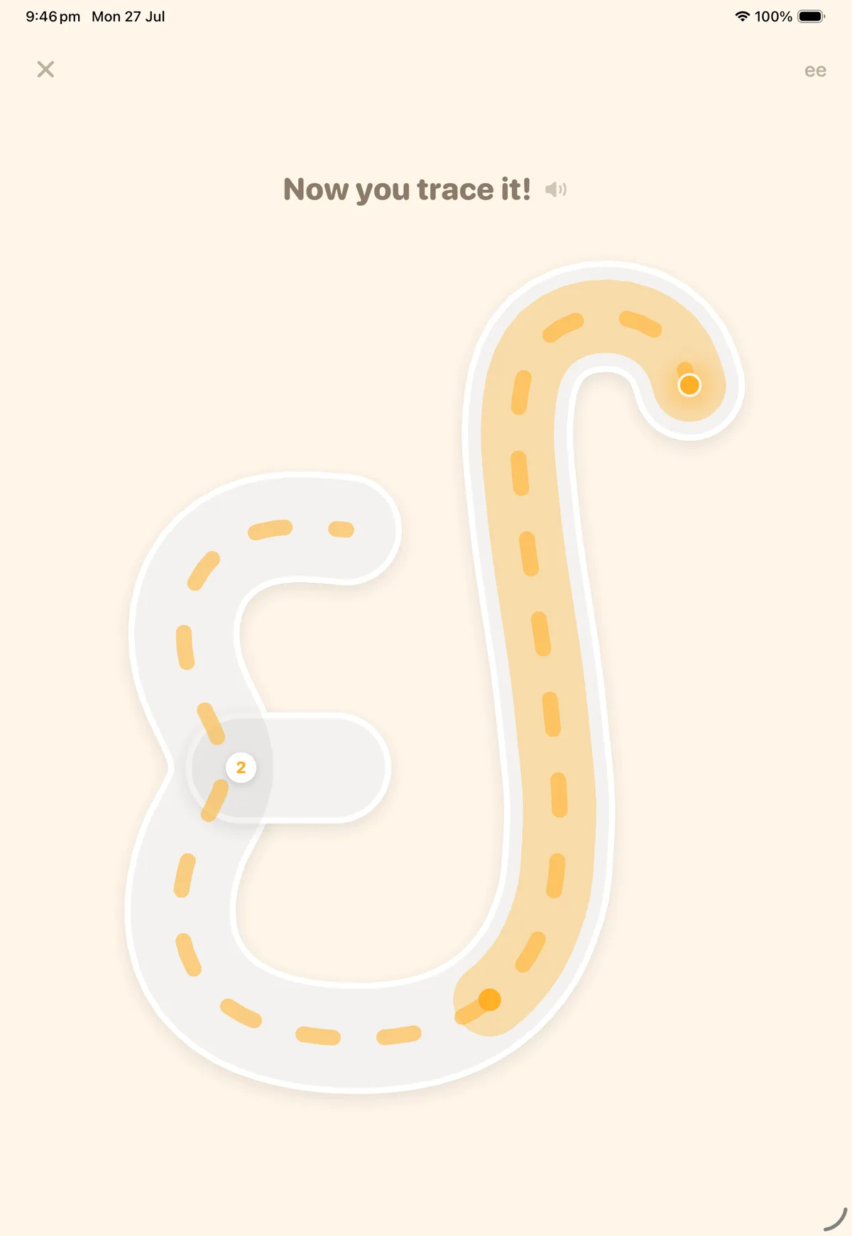 The Trace It screen on iPad: the letter ee drawn as a dashed road, its first stroke already filled marigold under the guide dot